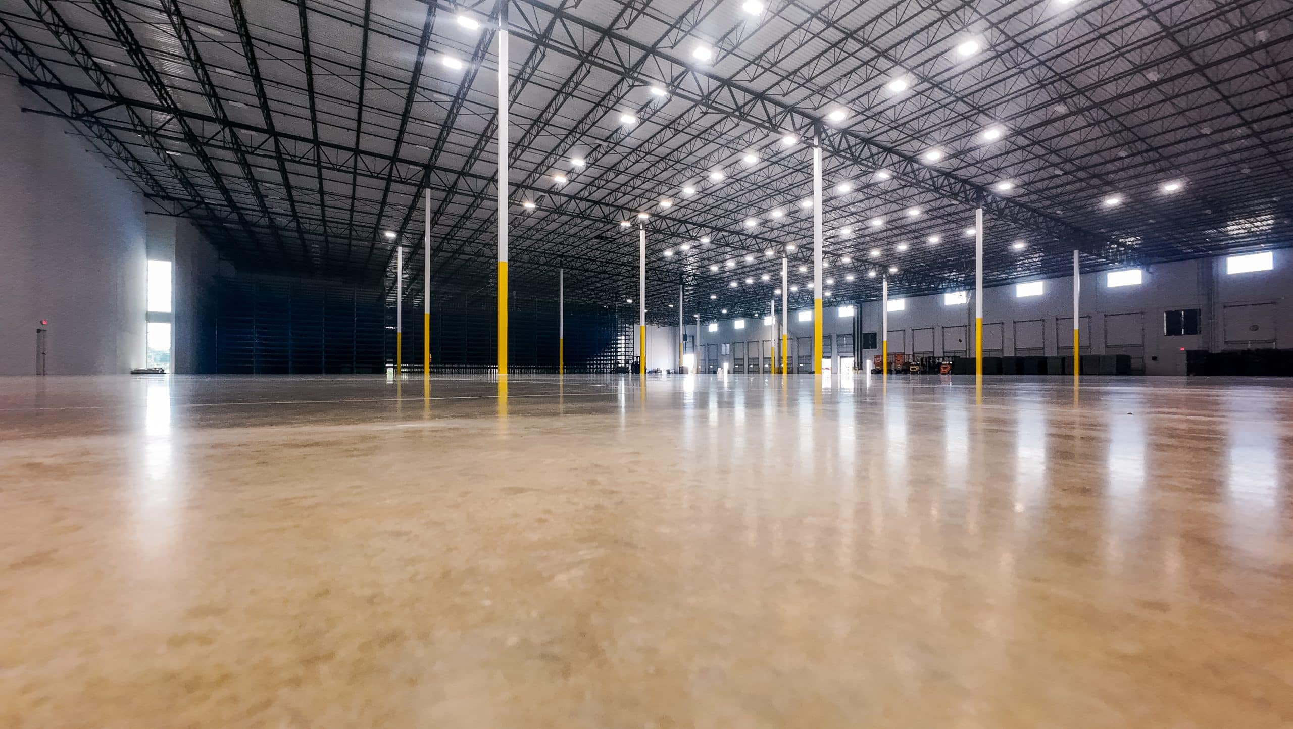 LED warehouse lighting over racking aisles