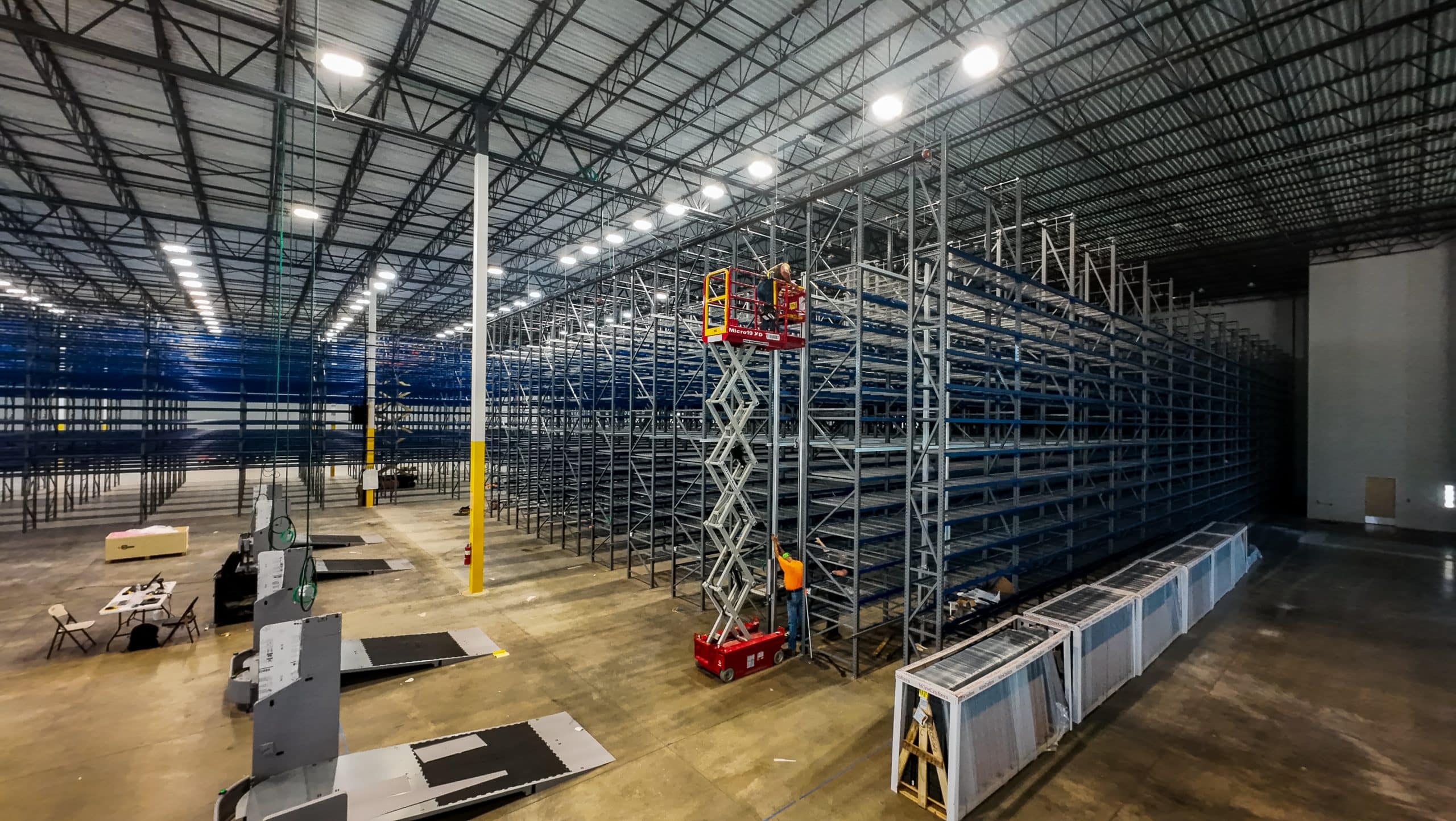 Crew installing warehouse pallet racking